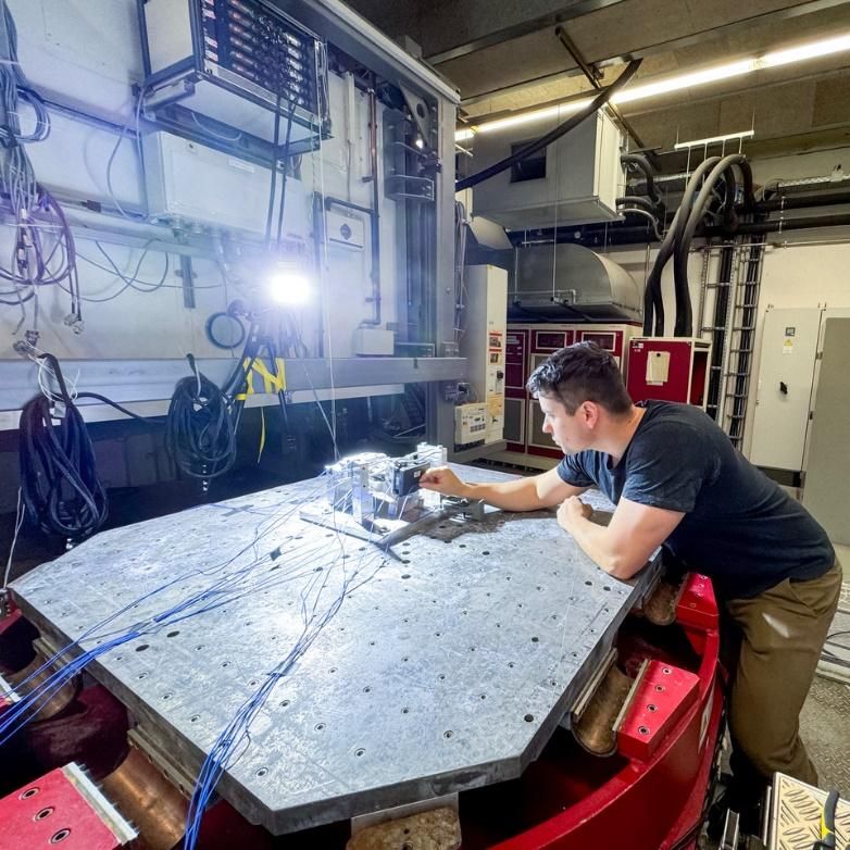 BMW motorcycle testing setup with optical measurement equipment